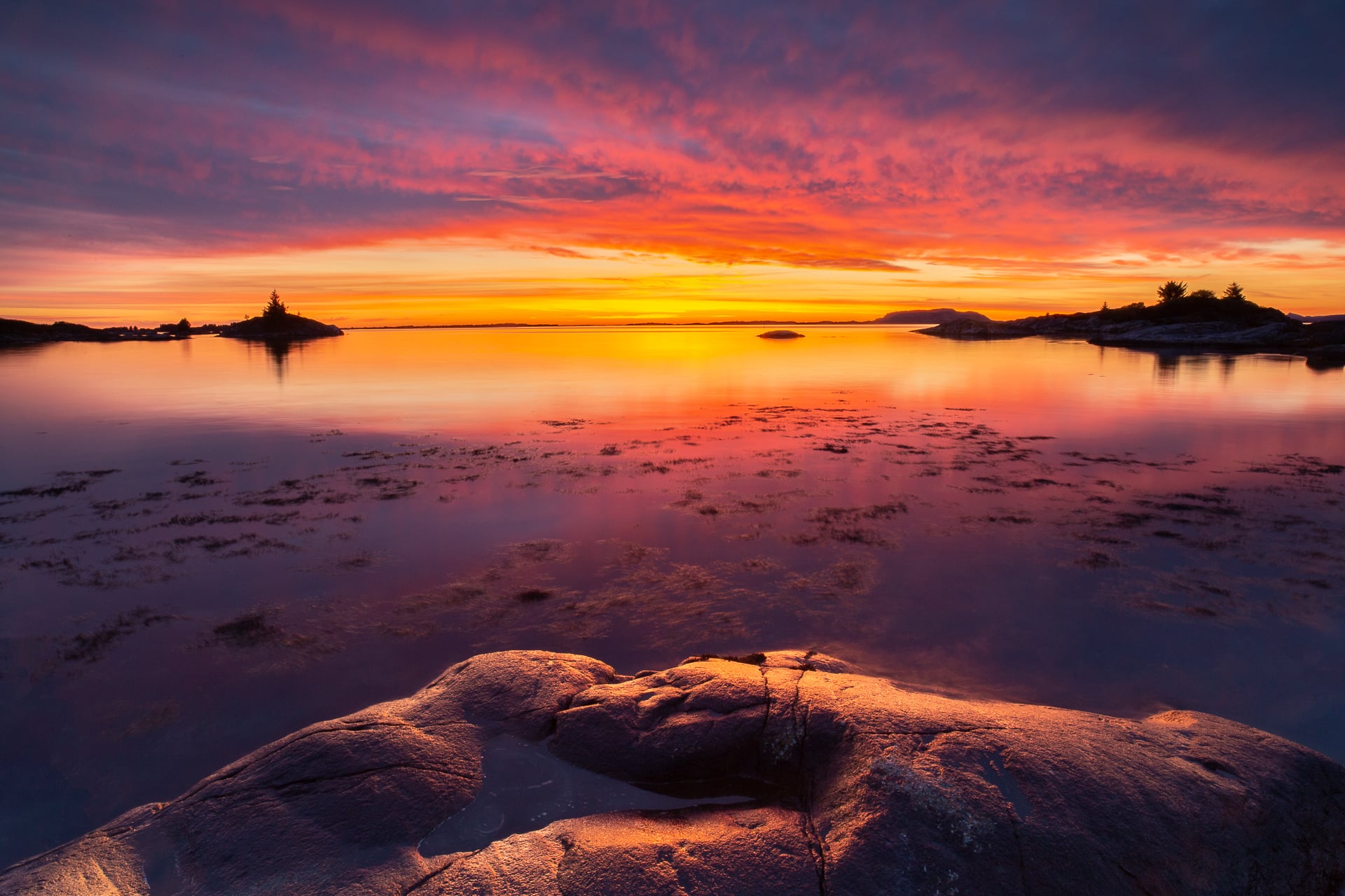 svaberg og solnedgang